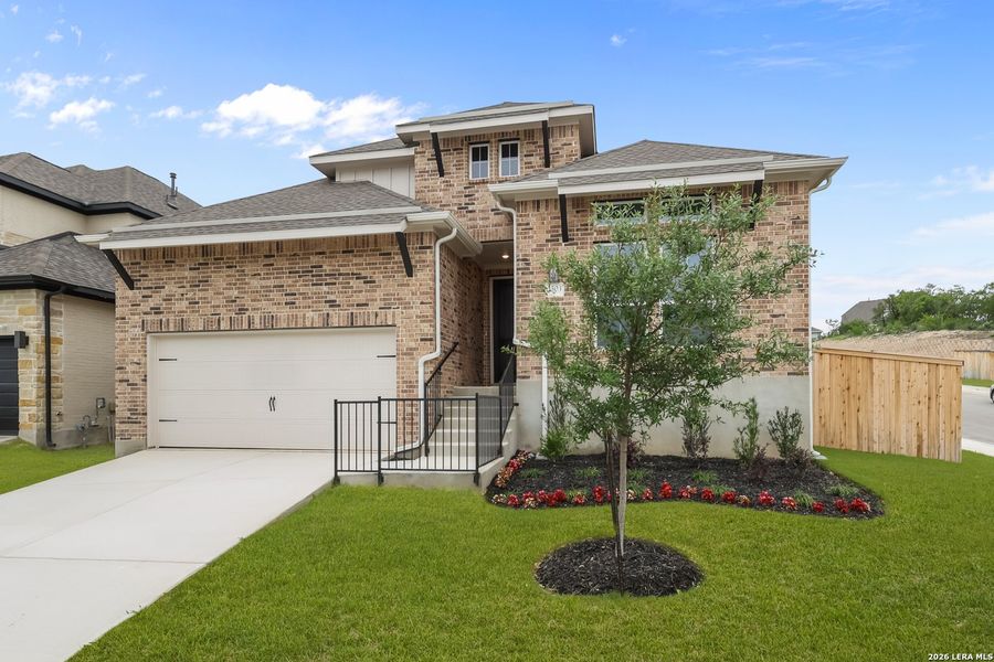Front exterior of a new home in Ladera, San Antonio, TX, highlighting curb appeal (Image 26). Front exterior of a new home in Ladera, San Antonio, TX, highlighting curb appeal (Image 26).