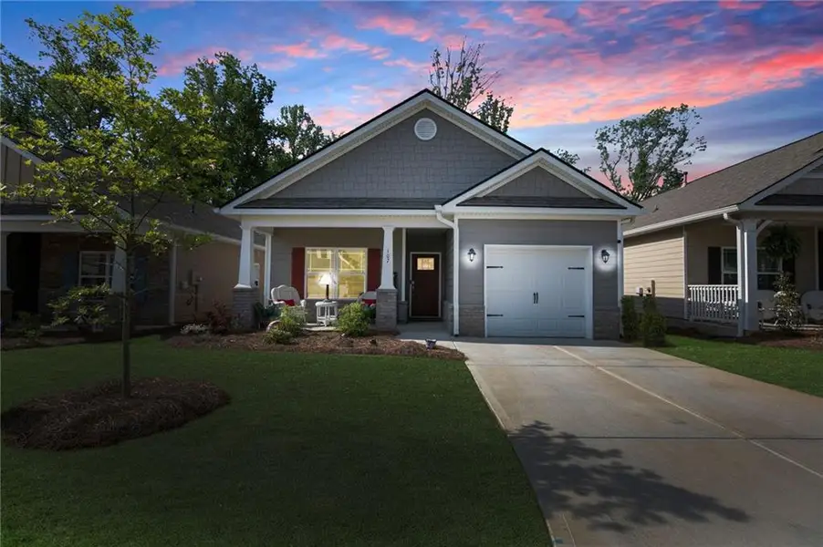 Front exterior of a new home in Windmill Park, Carrollton, GA, highlighting curb appeal (Image 1).