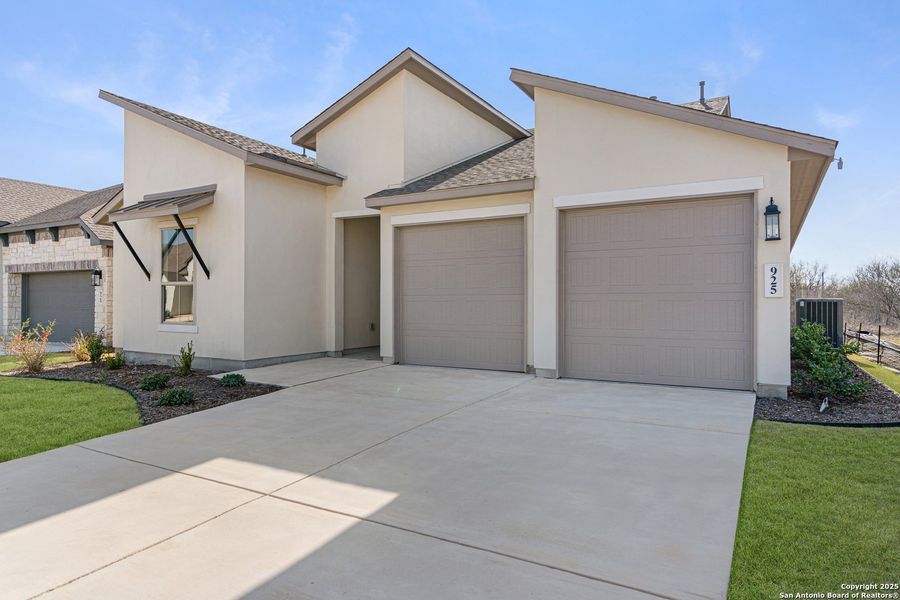 Front exterior of a new home in Nolte Farms, Seguin, TX, highlighting curb appeal (Image 22). Front exterior of a new home in Nolte Farms, Seguin, TX, highlighting curb appeal (Image 22).