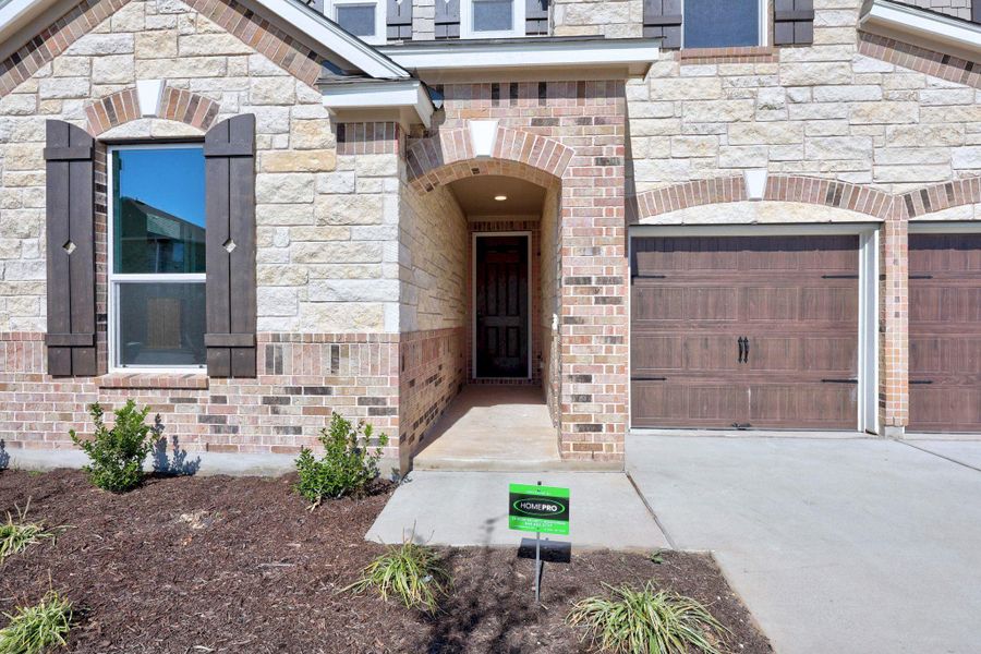 Exterior details and patio area of a home in Salerno - Classic Collection, Round Rock (Image 22).