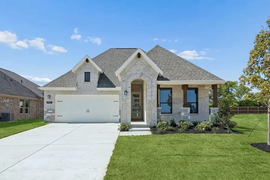 Front exterior of a new home in Parkmont – Timberbrook, Justin, TX, highlighting curb appeal (Image 1). Front exterior of a new home in Parkmont – Timberbrook, Justin, TX, highlighting curb appeal (Image 1).