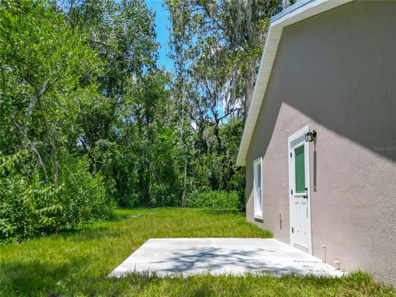 Front exterior of a new home in , Lake Panasoffkee, FL, highlighting curb appeal (Image 21).
