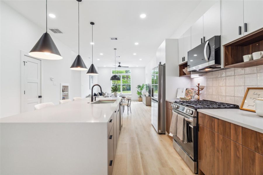Form meets function with generous counter space, clean-lined cabinetry, and an inviting flow that makes everyday cooking feel inspired. Form meets function with generous counter space, clean-lined cabinetry, and an inviting flow that makes everyday cooking feel inspired.