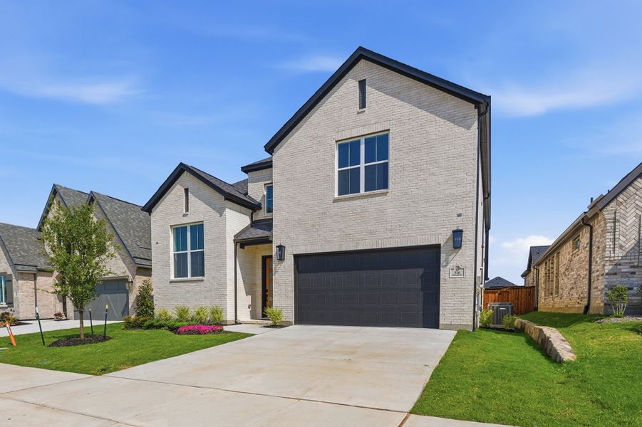 Front exterior of a new home in Hillside Village, Celina, TX, highlighting curb appeal (Image 22).