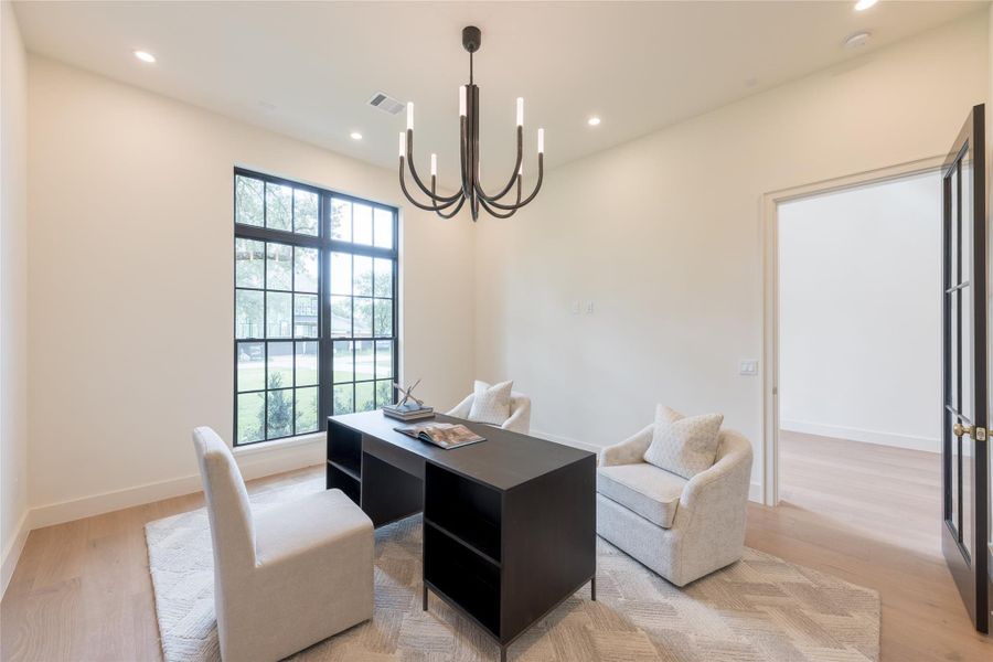 Bathed in natural light from an oversized black grid windows, the dedicated office space features European white oak floors, a striking Visual Comfort chandelier, and a spacious walk-in closet—perfect for storage, work-from-home flexibility, or future conversion into a guest or mother in law suite. Its minimal palette and clean lines offer a calming, elevated work environment with enduring style. Bathed in natural light from an oversized black grid windows, the dedicated office space features European white oak floors, a striking Visual Comfort chandelier, and a spacious walk-in closet—perfect for storage, work-from-home flexibility, or future conversion into a guest or mother in law suite. Its minimal palette and clean lines offer a calming, elevated work environment with enduring style.