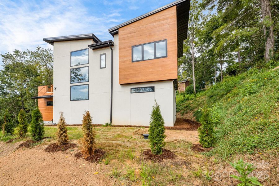 Front exterior of a new home in , Asheville, NC, highlighting curb appeal (Image 26). Front exterior of a new home in , Asheville, NC, highlighting curb appeal (Image 26).