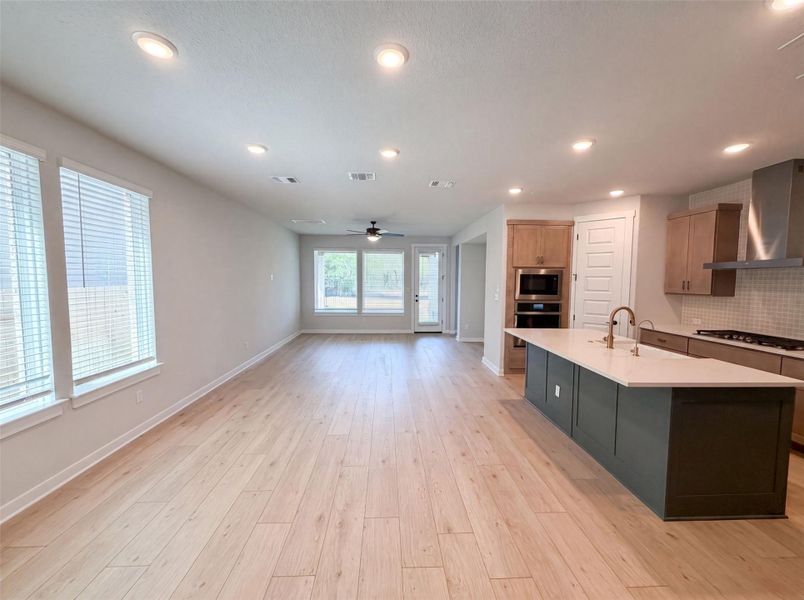 An open-concept living space integrates a well-appointed kitchen with a spacious common area, featuring ample natural light. An open-concept living space integrates a well-appointed kitchen with a spacious common area, featuring ample natural light.