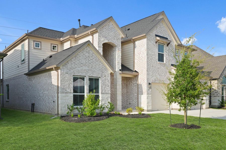 Front exterior of a new home in Morton Creek Ranch, Katy, TX, highlighting curb appeal (Image 16). Front exterior of a new home in Morton Creek Ranch, Katy, TX, highlighting curb appeal (Image 16).