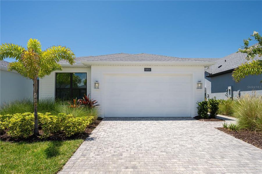 Front exterior of a new home in , Apollo Beach, FL, highlighting curb appeal (Image 1). Front exterior of a new home in , Apollo Beach, FL, highlighting curb appeal (Image 1).