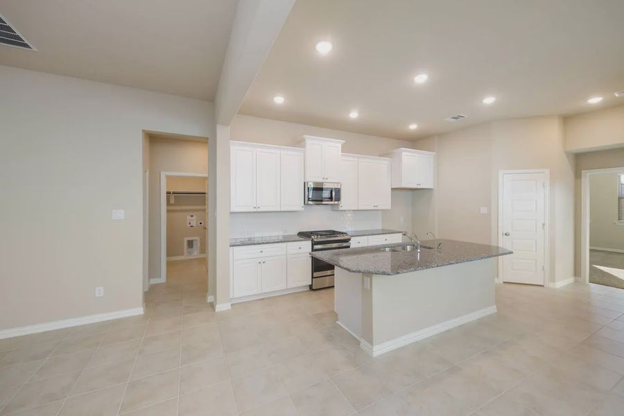 Representative furnished interior of a home built from the Charleston by Chesmar Homes in Stillwater Ranch, Buda (Image 9).