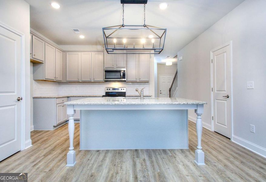 Furnished interior view inside a new home in Chimney Oaks Townhomes, Homer (Image 5).