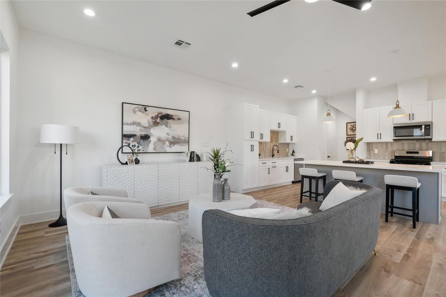 The kitchen and living areas flow seamlessly, allowing easy interaction while maintaining distinct spaces for each function. This thoughtful layout balances openness with defined zones, perfect for both everyday life and entertaining. It’s a design that maximizes both connectivity and comfort.