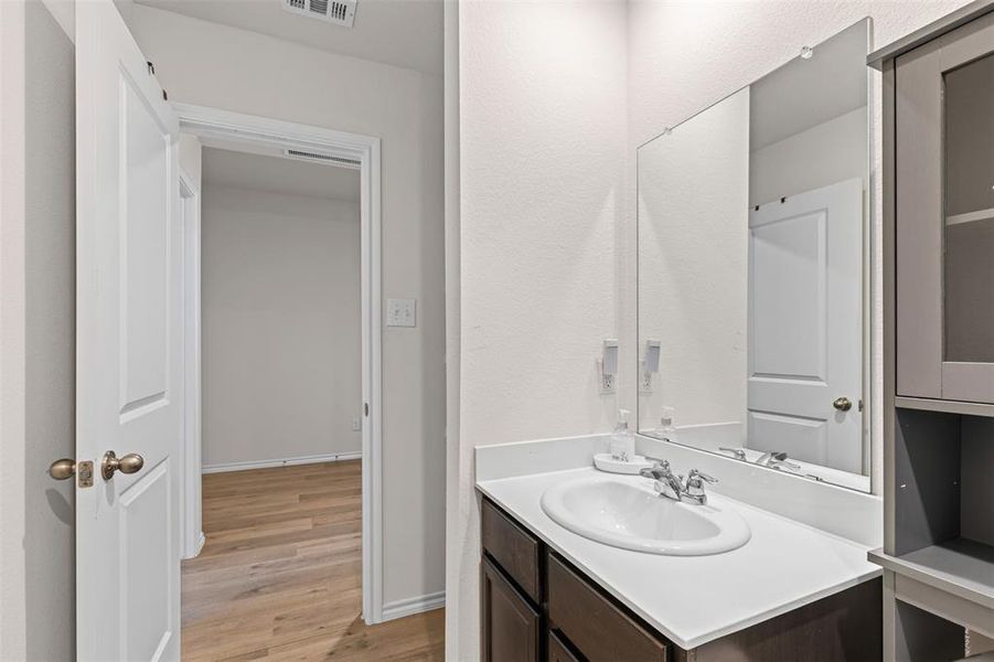 Full bathroom with modern vanity, ample storage, and shower/tub combo — perfect for family or guests. Full bathroom with modern vanity, ample storage, and shower/tub combo — perfect for family or guests.