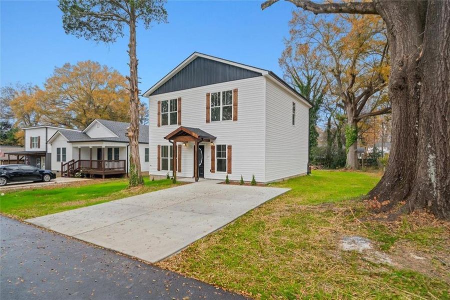 Front exterior of a new home in , Calhoun, GA, highlighting curb appeal (Image 2).
