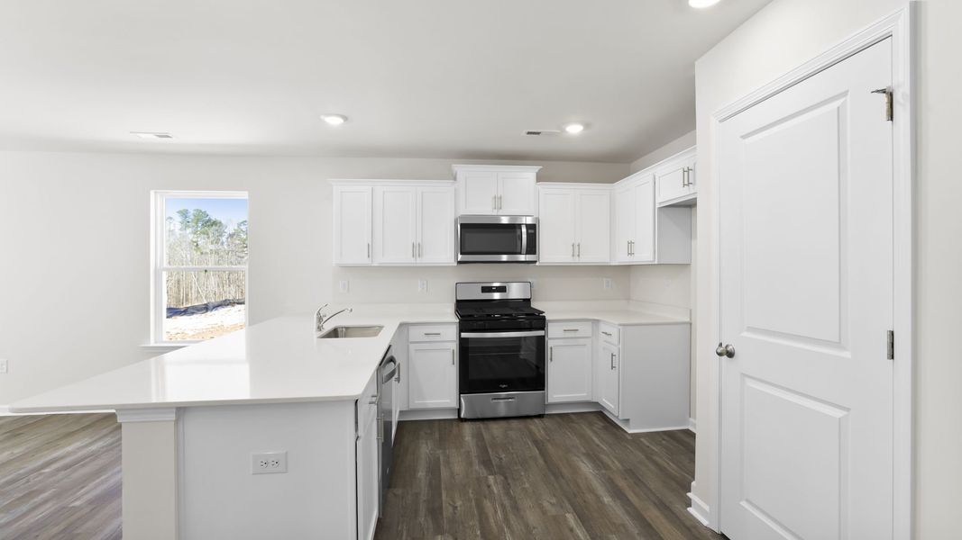 Furnished interior view inside a new home in Village Grove, Greenville (Image 8).