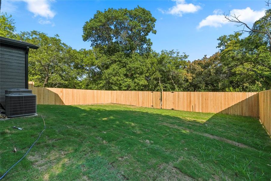View of fenced backyard