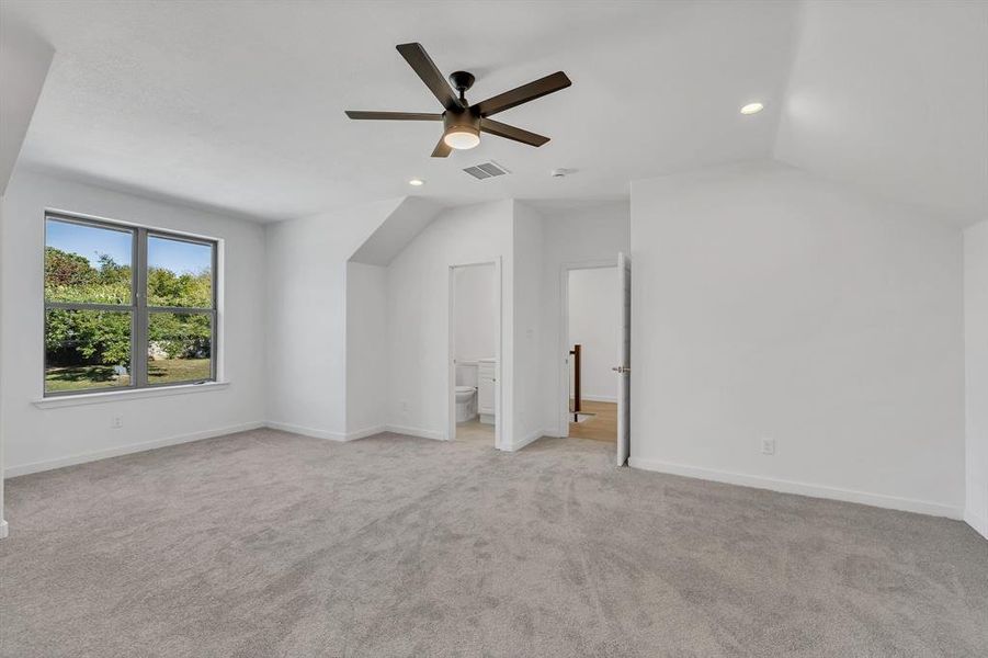 Bonus room featuring lofted ceiling, light carpet, recessed lighting, and ceiling fan