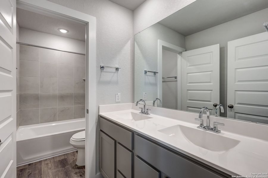 Furnished interior view inside a new home in Hacienda, San Antonio (Image 6).