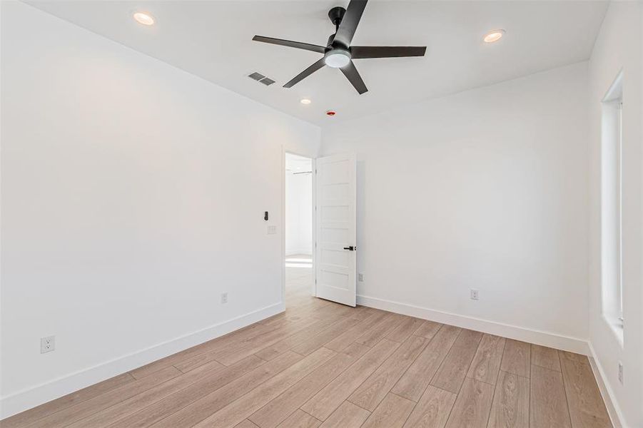 Spare room with light wood-type flooring, recessed lighting, and ceiling fan