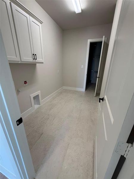 Washroom with cabinet space and gas dryer hookup Washroom with cabinet space and gas dryer hookup