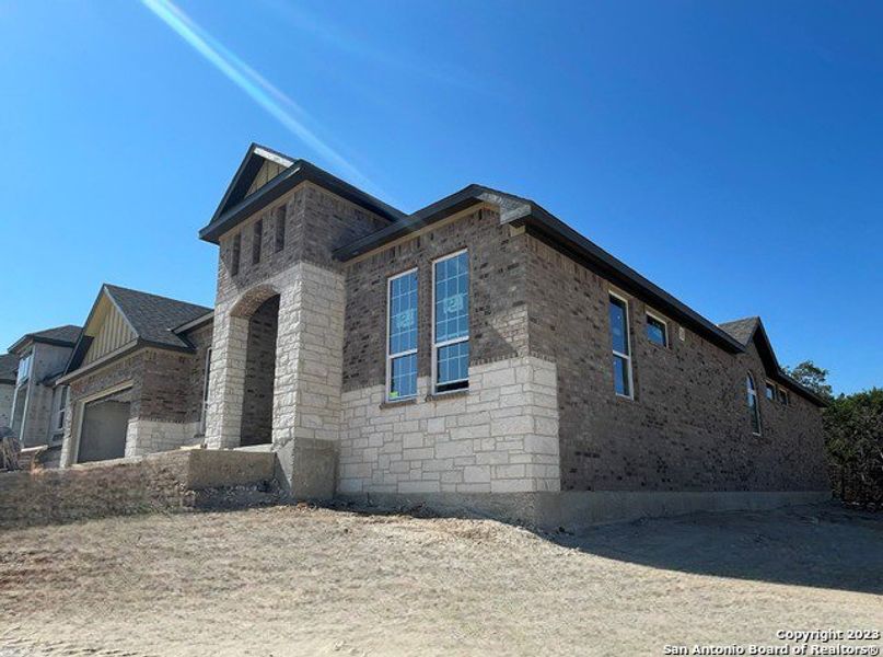 Front exterior of a new home in Sunday Creek at Kinder Ranch, San Antonio, TX, highlighting curb appeal (Image 1). Front exterior of a new home in Sunday Creek at Kinder Ranch, San Antonio, TX, highlighting curb appeal (Image 1).