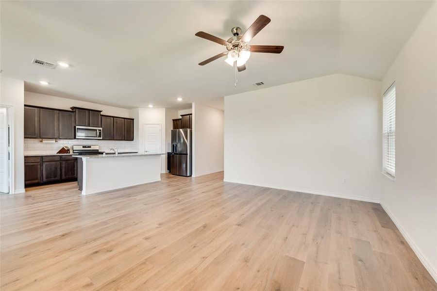 Unfurnished bedroom with multiple windows and carpet flooring Unfurnished bedroom with multiple windows and carpet flooring