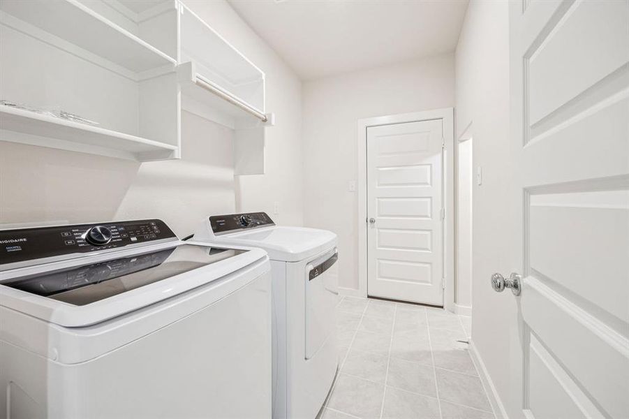 Utility Room in the Claret home plan by Trophy Signature Homes  REPRESENTATIVE PHOTO