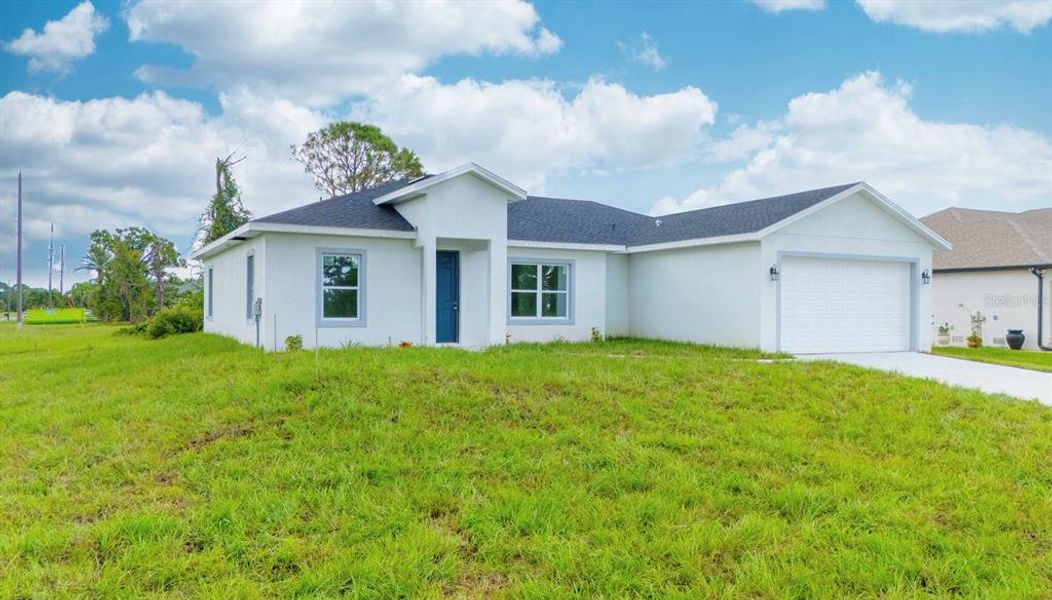 Front exterior of a new home in , Placida, FL, highlighting curb appeal (Image 28). Front exterior of a new home in , Placida, FL, highlighting curb appeal (Image 28).