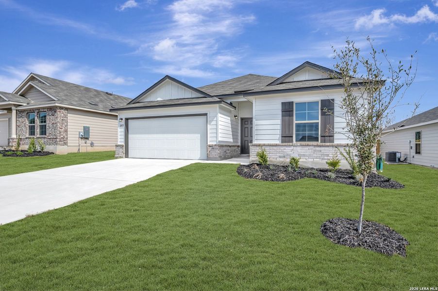 Front exterior of a new home in Greenspoint Heights, Seguin, TX, highlighting curb appeal (Image 16).