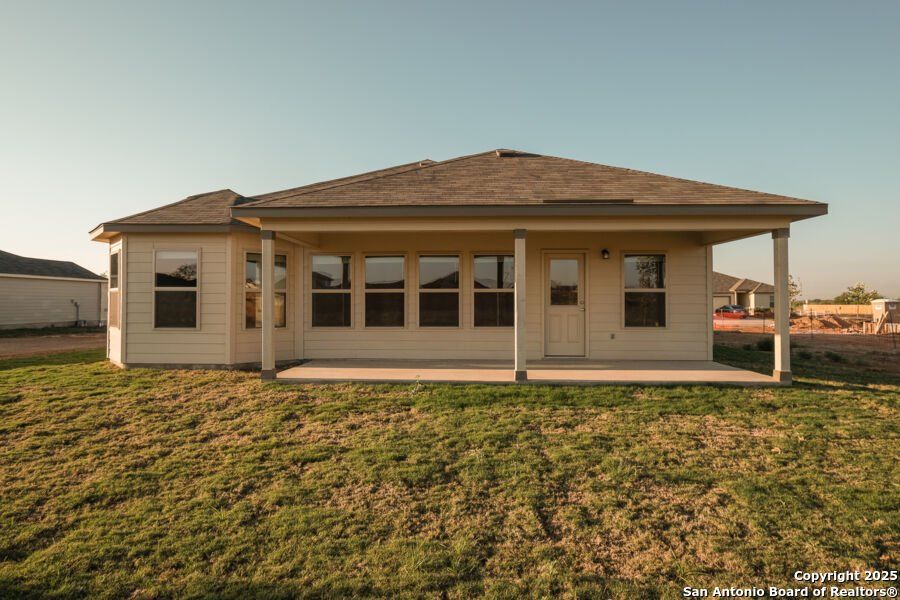Front exterior of a new home in Summer Hills, San Antonio, TX, highlighting curb appeal (Image 1).