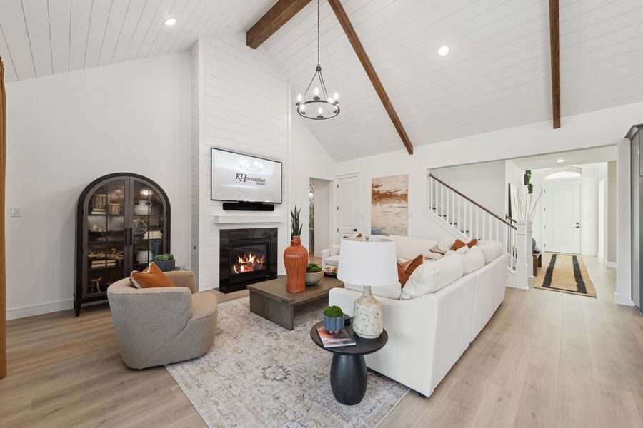 Great room with stained ceiling beams and vaulted ceiling Great room with stained ceiling beams and vaulted ceiling