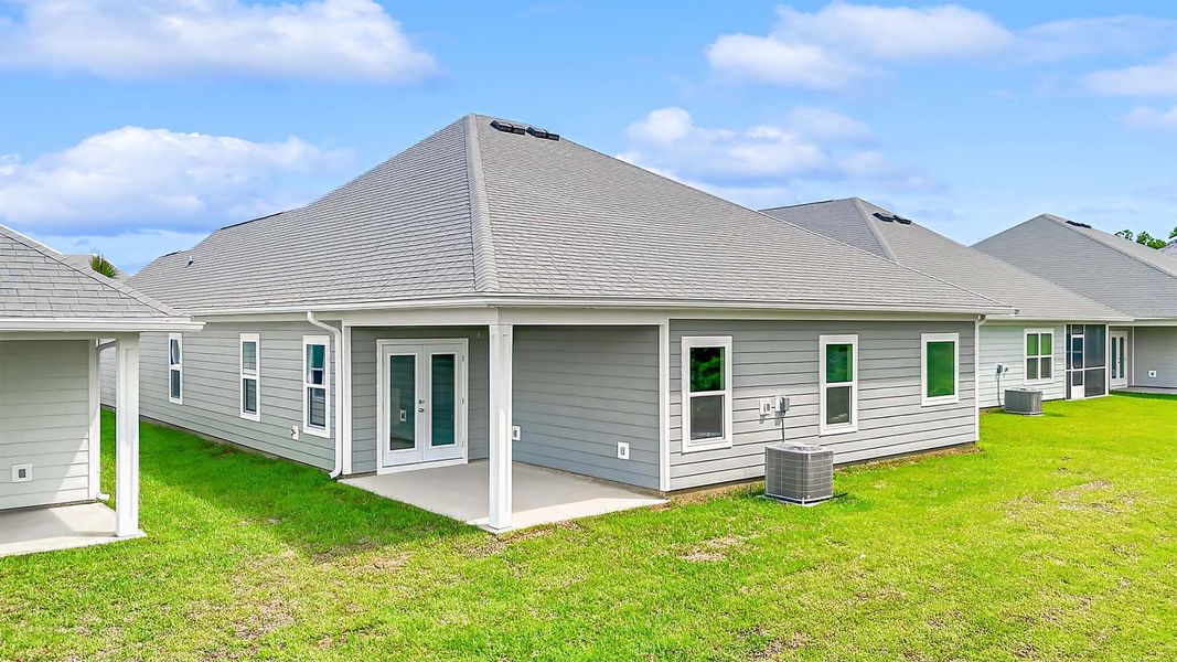 Exterior details and patio area of a home in WindMark Beach, Port Saint Joe (Image 3).