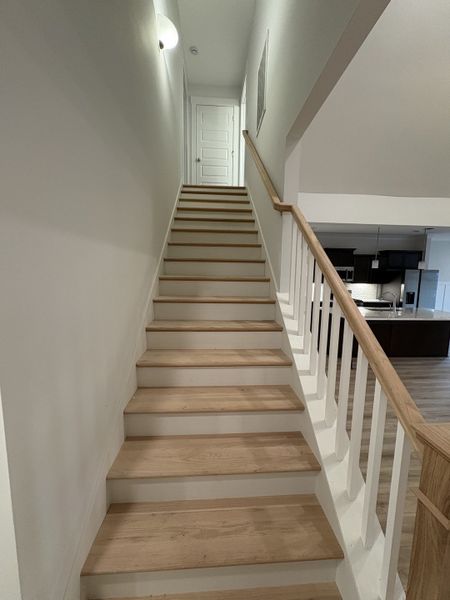 Stock image of completed house. Options and selections will vary in actual house.