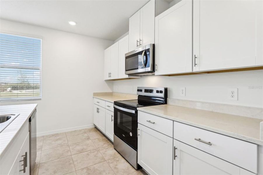 Furnished interior view inside a new home in Lake Deer Estates - Signature Series, Poinciana (Image 5). Furnished interior view inside a new home in Lake Deer Estates - Signature Series, Poinciana (Image 5).