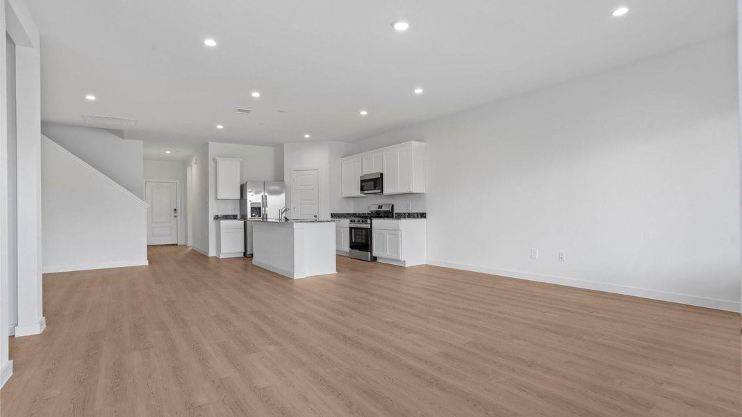 Spacious, unfurnished interior of a new home in Caldwell Crossing, Iowa Colony (Image 11).