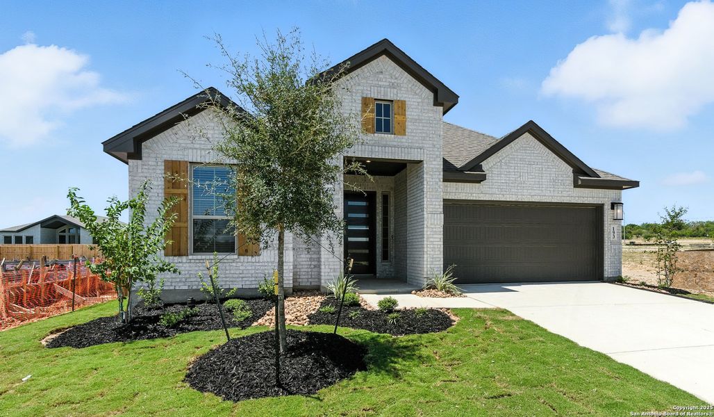 Front exterior of a new home in Alsatian Oaks, Castroville, TX, highlighting curb appeal (Image 25).