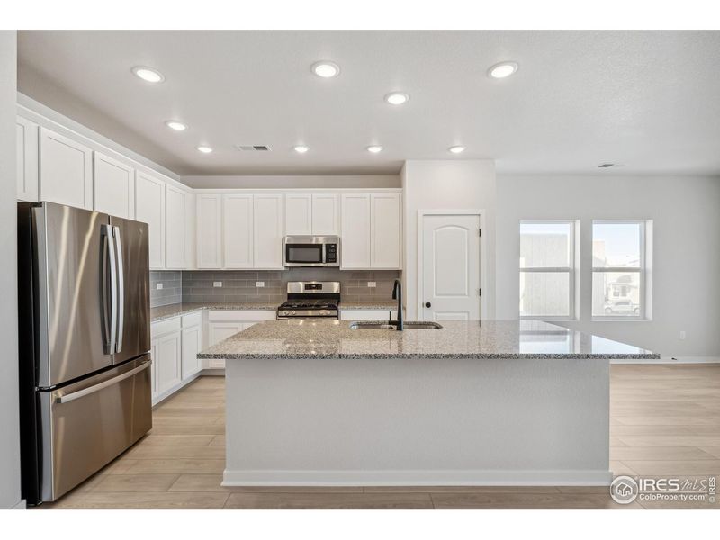 Furnished interior view inside a new home in Kinston Mainstreet Townhomes, Loveland (Image 18).