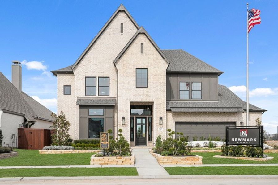 Front exterior of a new home in Meridiana 40', 65', Manvel, TX, highlighting curb appeal (Image 21).