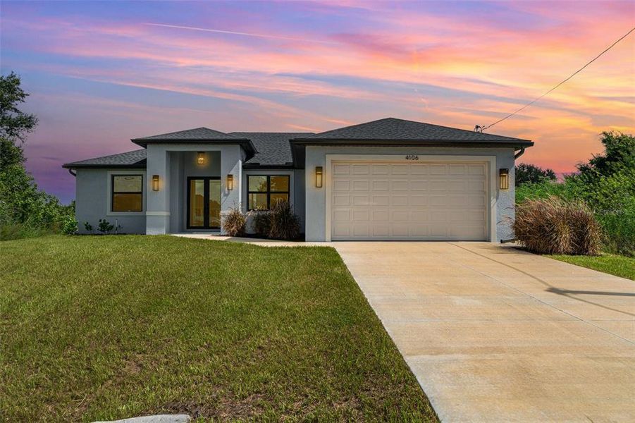 Front exterior of a new home in , Lehigh Acres, FL, highlighting curb appeal (Image 2).