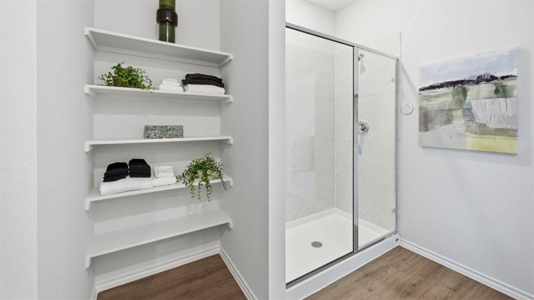 Full bath with a stall shower and light wood-type flooring Full bath with a stall shower and light wood-type flooring
