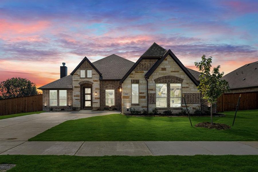 Front exterior of a new home in The Grove, Midlothian, TX, highlighting curb appeal (Image 1). Front exterior of a new home in The Grove, Midlothian, TX, highlighting curb appeal (Image 1).
