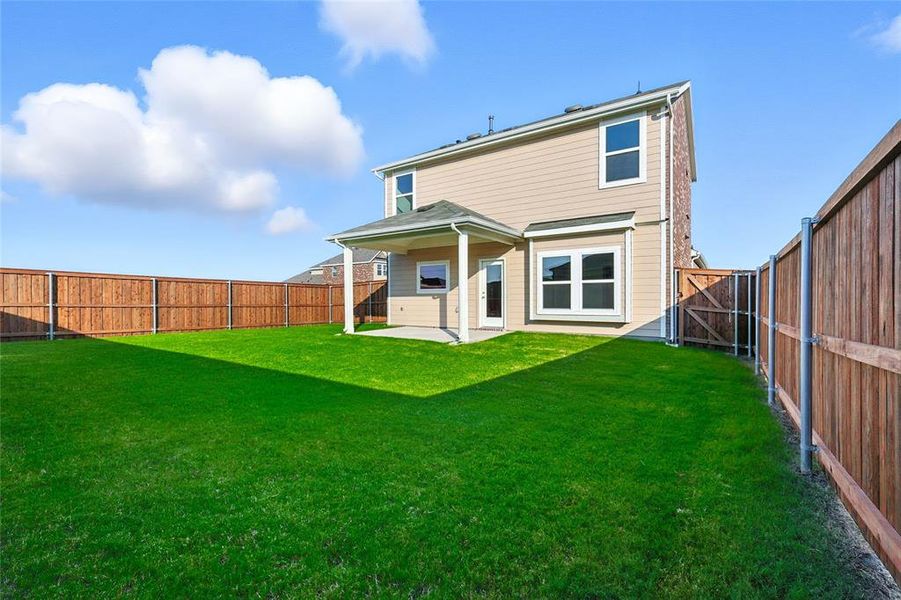 Back of property featuring a patio and a fenced backyard Back of property featuring a patio and a fenced backyard