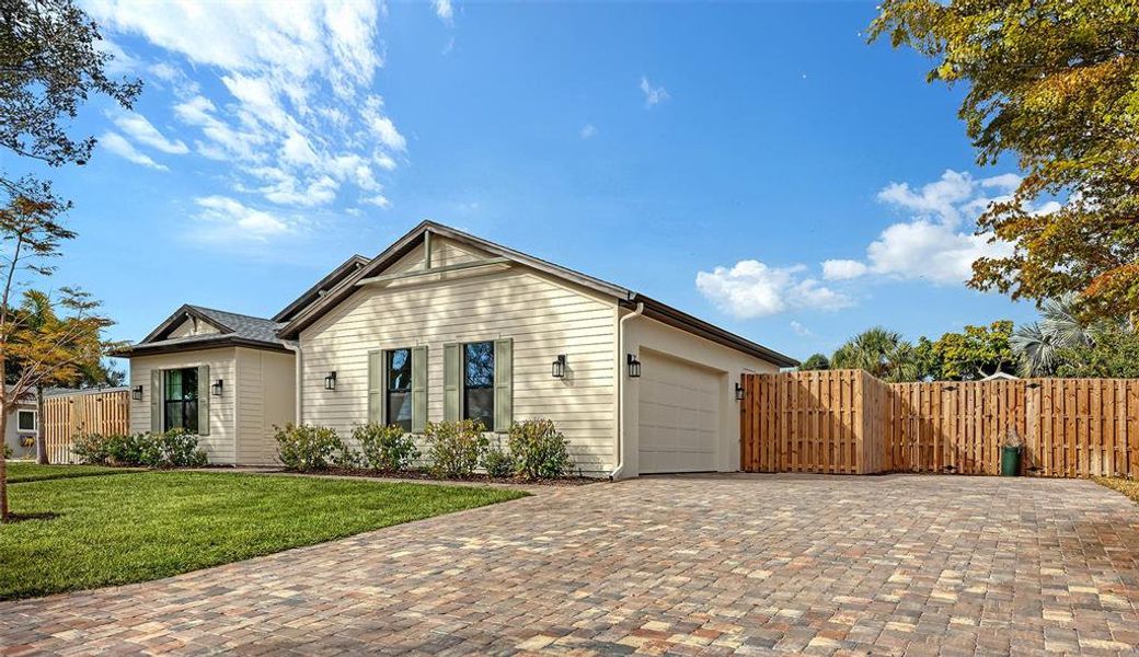 Front exterior of a new home in , Sarasota, FL, highlighting curb appeal (Image 20).