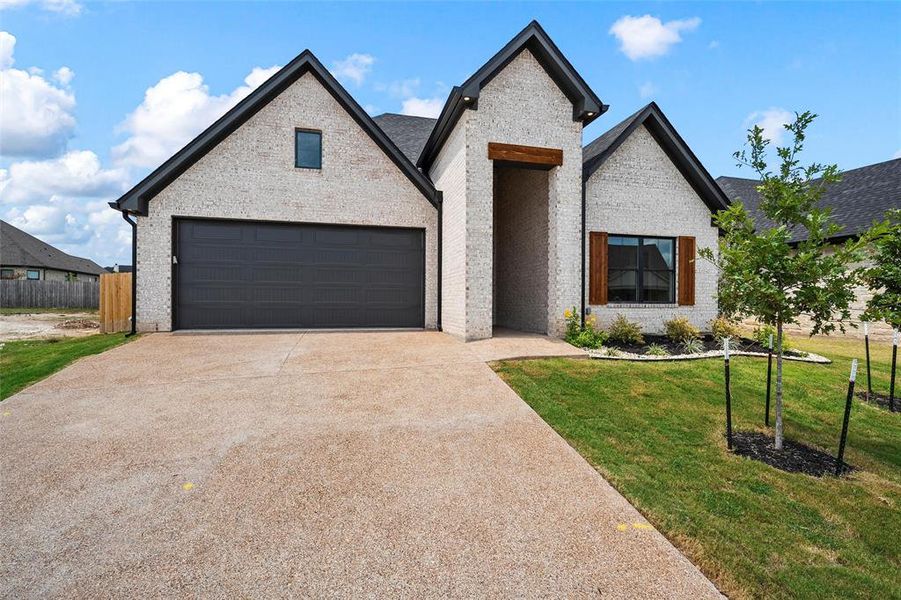 Front exterior of a new home in , Woodway, TX, highlighting curb appeal (Image 1). Front exterior of a new home in , Woodway, TX, highlighting curb appeal (Image 1).