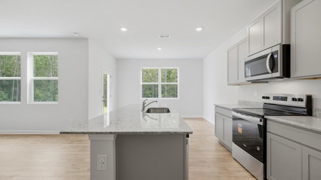 Furnished interior view inside a new home in Oaks at Cedar Grove, Fairburn (Image 6).