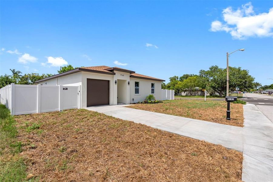 Front exterior of a new home in , Port Richey, FL, highlighting curb appeal (Image 21).