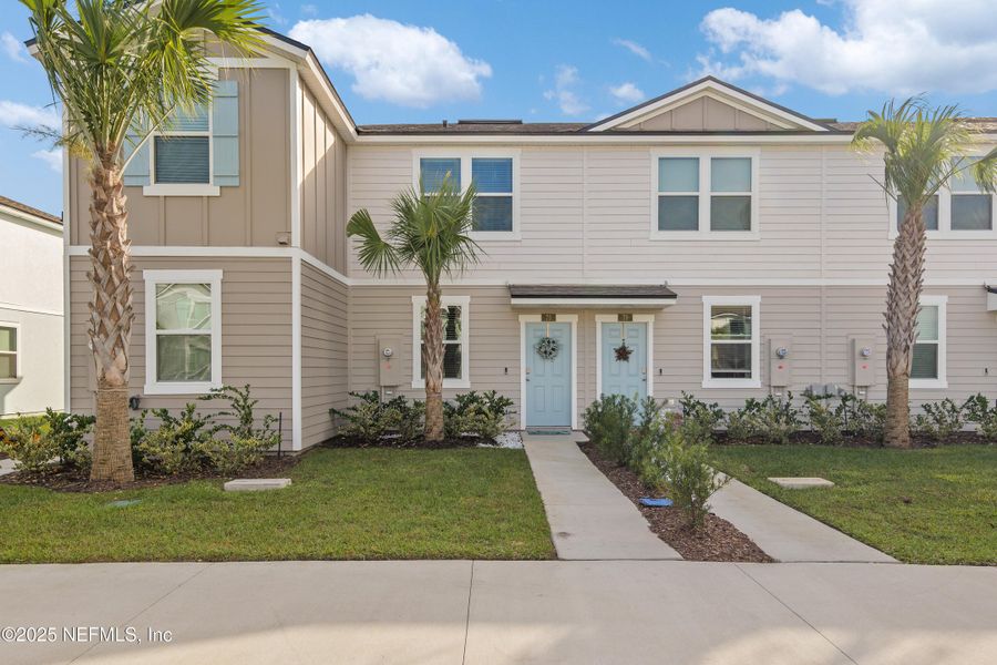 Front exterior of a new home in , St. Augustine, FL, highlighting curb appeal (Image 1).
