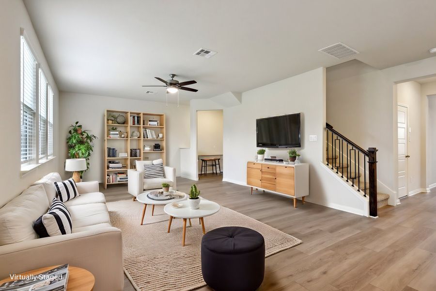 Virtually staged living room in the Red River floorplan at a Meritage Homes community.