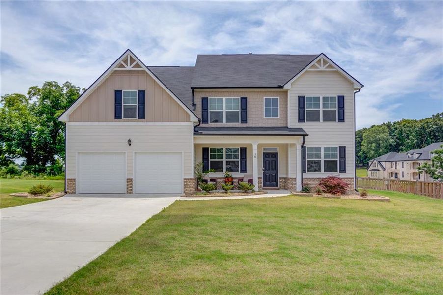 Front exterior of a new home in Stillwater Springs, Dacula, GA, highlighting curb appeal (Image 26). Front exterior of a new home in Stillwater Springs, Dacula, GA, highlighting curb appeal (Image 26).