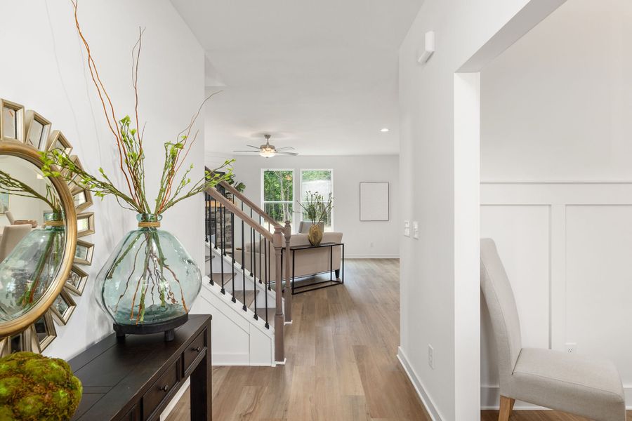 The foyer leads to the open-concept kitchen, family room, and dining spaces